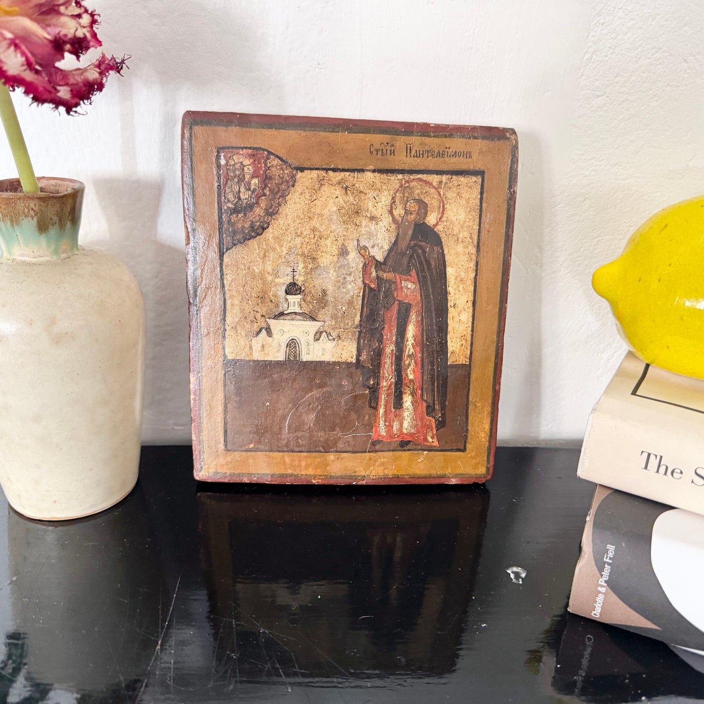 Saint Panteleimon in Prayer Before the Church. 19th-century Icon on Wood.
